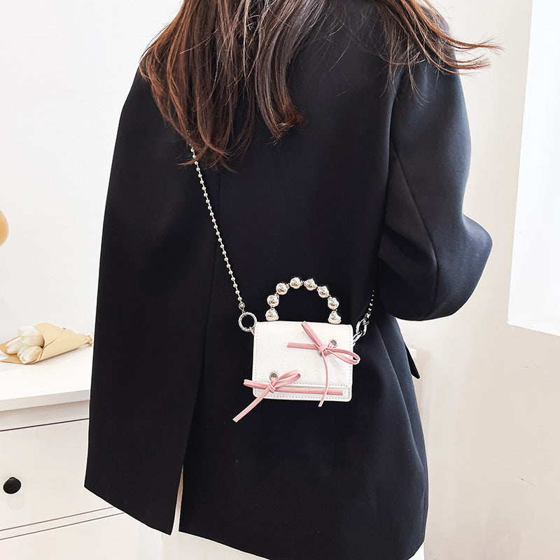 Mini sac à bandoulière mignon avec chaîne et nœud noir et rose